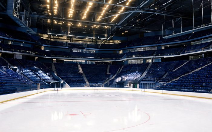 A modern college hockey arena during a game